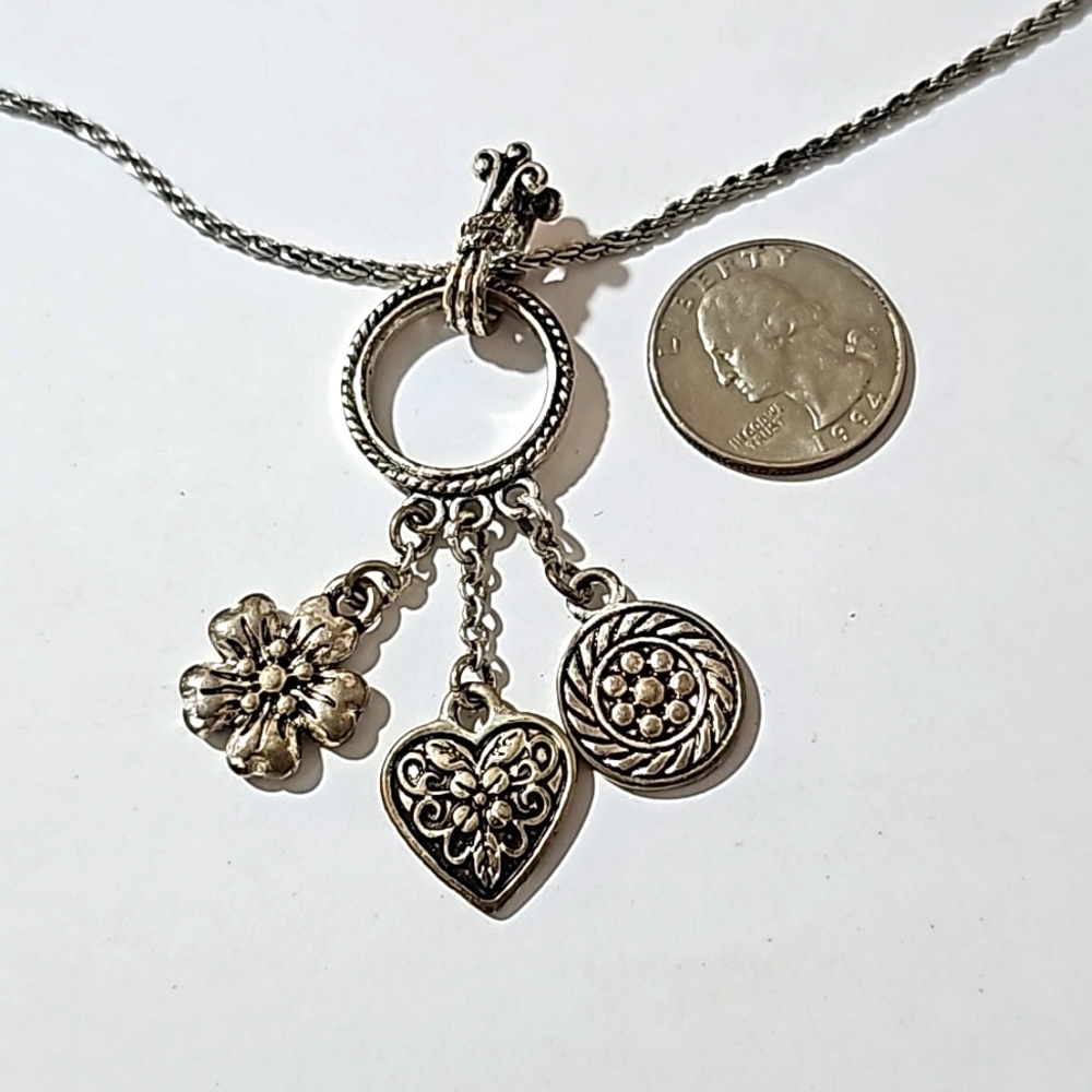 Silver tone charm necklace